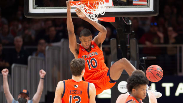 Auburn forward Jabari Smith (10) dunks during the second half of an NCAA college basketball game against Nebraska, Saturday, Dec. 11 , 2021, in Atlanta. (AP Photo/Hakim Wright Sr.)